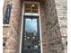 Beautiful front door with a transom window and a stylish exterior light fixture at 2145 Coventry Dr, Brookhaven, GA 30319