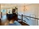 Open-concept living space with hardwood floors and stairs leading to lower level at 2145 Coventry Dr, Brookhaven, GA 30319