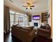 Comfortable living room with a fireplace, built-in shelves, and a balcony view at 2145 Coventry Dr, Brookhaven, GA 30319