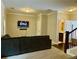 Cozy living room area with a television, staircase, and doorway to bathroom at 2145 Coventry Dr, Brookhaven, GA 30319