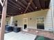 Back patio with string lights and small fenced area at 2145 Coventry Dr, Brookhaven, GA 30319