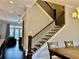 A staircase with dark wood banister, leading to a living space, offers a glimpse of the home's interior at 2145 Coventry Dr, Brookhaven, GA 30319