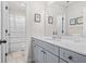 Stylish bathroom with a vanity, framed mirrors, and a shower with curtain at 361 Traditions Ln, Hampton, GA 30228