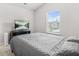 Welcoming bedroom with a flat screen TV, comfortable bed, and scenic view at 361 Traditions Ln, Hampton, GA 30228