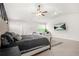 Serene bedroom offers a large bed, ceiling fan, and a wall-mounted TV for relaxation at 361 Traditions Ln, Hampton, GA 30228