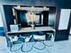 Stylish bar with cowhide barstools, white countertops, a mirror, and black wooden cabinets at 400 W Peachtree Nw St # 3412, Atlanta, GA 30308