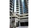 The entrance to the building at 12 Centennial Park features modern architecture and convenient covered parking at 400 W Peachtree Nw St # 3412, Atlanta, GA 30308