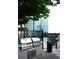 Outdoor grilling station with two stainless steel grills near the pool and fenced area at 400 W Peachtree Nw St # 3412, Atlanta, GA 30308