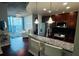 Modern kitchen with granite countertops, stainless steel appliances, and bar stool seating at 400 W Peachtree Nw St # 3412, Atlanta, GA 30308