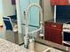 Close up of the kitchen stainless steel sink and faucet with pull-down sprayer at 400 W Peachtree Nw St # 3412, Atlanta, GA 30308