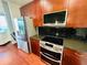 Modern kitchen featuring updated appliances, sleek countertops, and a subway tile backsplash at 400 W Peachtree Nw St # 3412, Atlanta, GA 30308