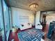 Open-concept living room with a modern chandelier, hardwood floors, and city views at 400 W Peachtree Nw St # 3412, Atlanta, GA 30308