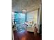 Bright living room with floor-to-ceiling windows and comfortable white recliners at 400 W Peachtree Nw St # 3412, Atlanta, GA 30308
