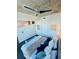 Modern primary bedroom with ceiling fan and chic, contemporary furniture at 400 W Peachtree Nw St # 3412, Atlanta, GA 30308