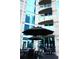 Relax on the outdoor patio, complete with comfortable seating, umbrellas, and views of the building's modern design at 400 W Peachtree Nw St # 3412, Atlanta, GA 30308