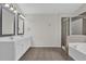 A bathroom features double sinks, tile floors and a separate tub and shower at 5891 Buckner Creek Dr, Mableton, GA 30126
