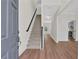 Bright entryway with hardwood floors and staircase leading to the upper level at 5891 Buckner Creek Dr, Mableton, GA 30126