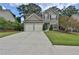 Charming two-story home with a well-maintained lawn and attached two-car garage at 5891 Buckner Creek Dr, Mableton, GA 30126
