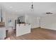 Open floor plan showcasing the living room with hardwood flooring and modern lighting at 5891 Buckner Creek Dr, Mableton, GA 30126