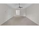 A spacious main bedroom features a ceiling fan and a door leading to the bathroom at 5891 Buckner Creek Dr, Mableton, GA 30126