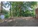 Wide backyard with mature trees and a detached garage at 804 Brookdale Sw Dr, Atlanta, GA 30315