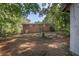 Spacious, treed backyard with a brick house in the background at 804 Brookdale Sw Dr, Atlanta, GA 30315