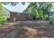 Treed backyard with a brick house in the background at 804 Brookdale Sw Dr, Atlanta, GA 30315