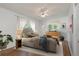 Cozy bedroom with neutral tones, natural light, ceiling fan, and hardwood floors at 804 Brookdale Sw Dr, Atlanta, GA 30315