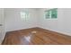 A bedroom with hardwood floors and two windows at 804 Brookdale Sw Dr, Atlanta, GA 30315