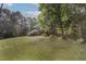 Home on a hill surrounded by mature trees and a large front yard at 804 Brookdale Sw Dr, Atlanta, GA 30315