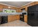 The kitchen area includes light wood cabinets and a black refrigerator at 804 Brookdale Sw Dr, Atlanta, GA 30315