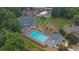 Aerial view of community pool, tennis courts, playground, parking and landscaping at 1010 San Marcos Cv, Lawrenceville, GA 30043