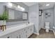 Bright bathroom with a large mirror and a walk-in shower at 1010 San Marcos Cv, Lawrenceville, GA 30043