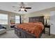 Relaxing bedroom featuring neutral tones, plenty of natural light, and modern furnishings at 1010 San Marcos Cv, Lawrenceville, GA 30043