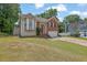 Charming two-story home with brick and siding, well-manicured lawn, and a two-car garage at 1010 San Marcos Cv, Lawrenceville, GA 30043