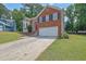 Charming two-story home with brick and siding, well-manicured lawn, and a two-car garage at 1010 San Marcos Cv, Lawrenceville, GA 30043