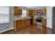 Well-lit kitchen boasts stainless steel appliances, ample oak cabinetry, and a durable countertop at 1010 San Marcos Cv, Lawrenceville, GA 30043