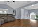 Open living room with hardwood floors, vaulted ceilings, and a bright, airy feel at 1010 San Marcos Cv, Lawrenceville, GA 30043