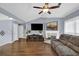 Comfortable living room with a cozy fireplace, plush seating, and a large TV at 1010 San Marcos Cv, Lawrenceville, GA 30043