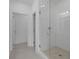 Modern bathroom featuring glass shower, white subway tile, and neutral toned tile floors at 114 Brackley Dr, Cumming, GA 30040