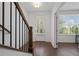 Stylish foyer with hardwood flooring and natural light from the front door at 114 Brackley Dr, Cumming, GA 30040