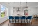 Bright kitchen features a quartz island, stainless appliances, and stylish seating at 114 Brackley Dr, Cumming, GA 30040