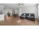 Open-concept living space with modern furnishings and a seamless flow to the kitchen at 114 Brackley Dr, Cumming, GA 30040