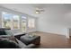 Bright living room with large windows, and a comfortable sectional sofa at 114 Brackley Dr, Cumming, GA 30040