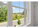 Large window showcasing lush greenery and distant views at 114 Brackley Dr, Cumming, GA 30040