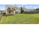 Large backyard with a green lawn, patio, and deck, perfect for outdoor enjoyment and entertaining at 1910 Towne Park Dr, Mcdonough, GA 30252