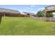Expansive backyard featuring a lush green lawn and wooden privacy fence, great for to play at 1910 Towne Park Dr, Mcdonough, GA 30252