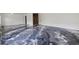 Basement featuring a freshly painted wall and a new epoxy floor coating at 1910 Towne Park Dr, Mcdonough, GA 30252