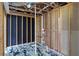 Unfinished basement floor showing a new epoxy coating and exposed studs and infrastructure at 1910 Towne Park Dr, Mcdonough, GA 30252