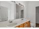 Bathroom features a double sink vanity, a large mirror, and wood cabinets at 1910 Towne Park Dr, Mcdonough, GA 30252